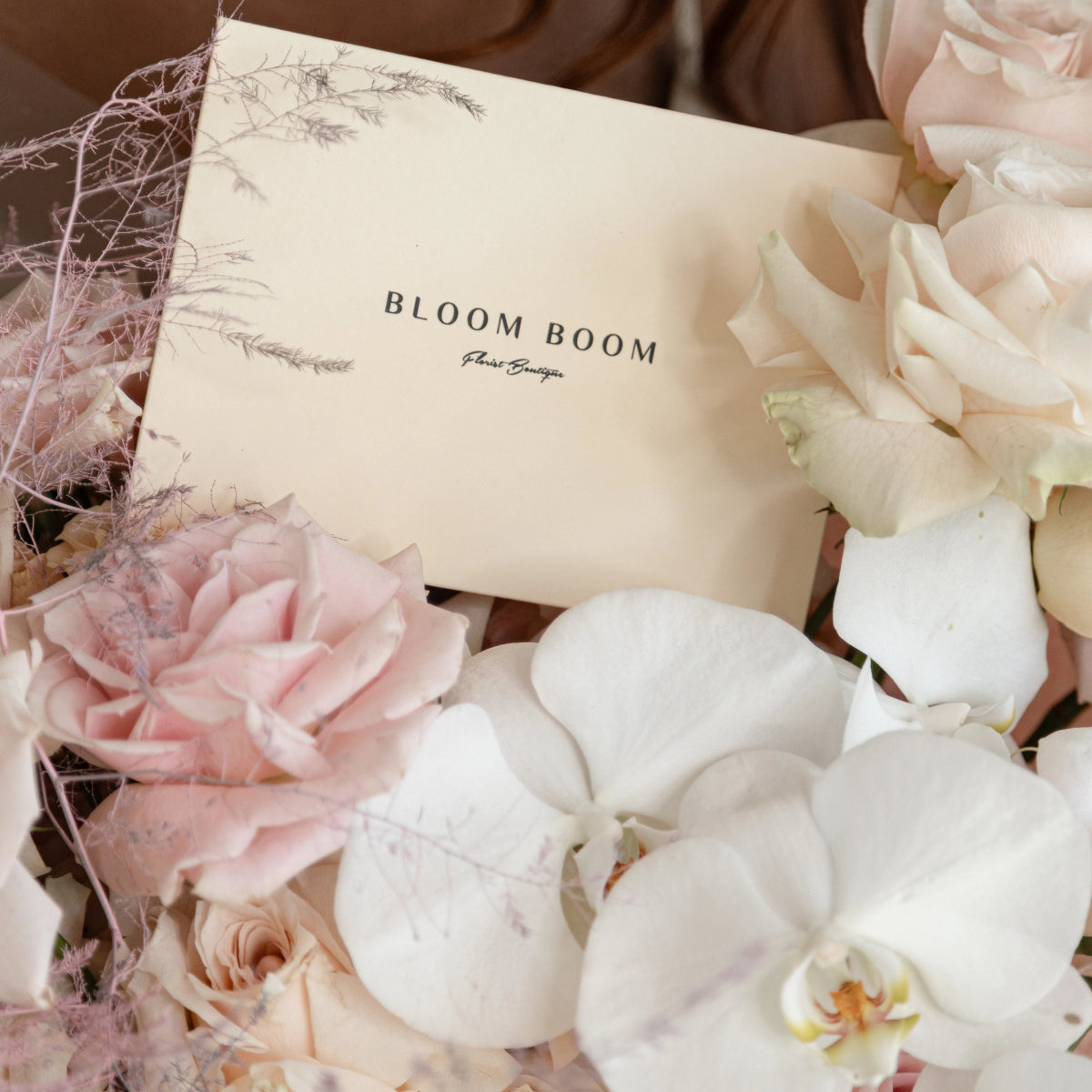 Bloom Boom luxury flower bouquet with blush pink roses, white orchids and hydrangeas with branded card