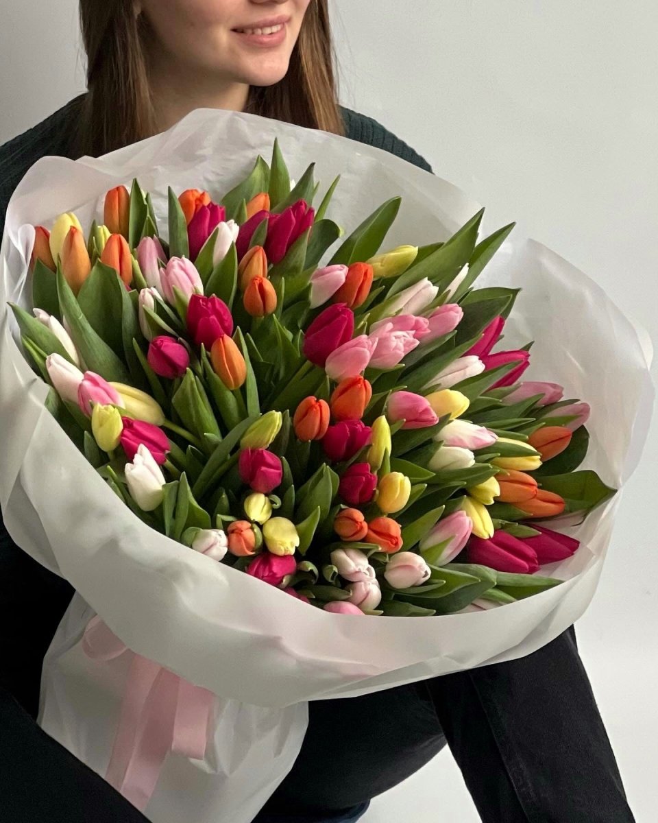 Large bouquet of 75 mixed tulips in pink, yellow, orange, white and magenta wrapped in white paper
