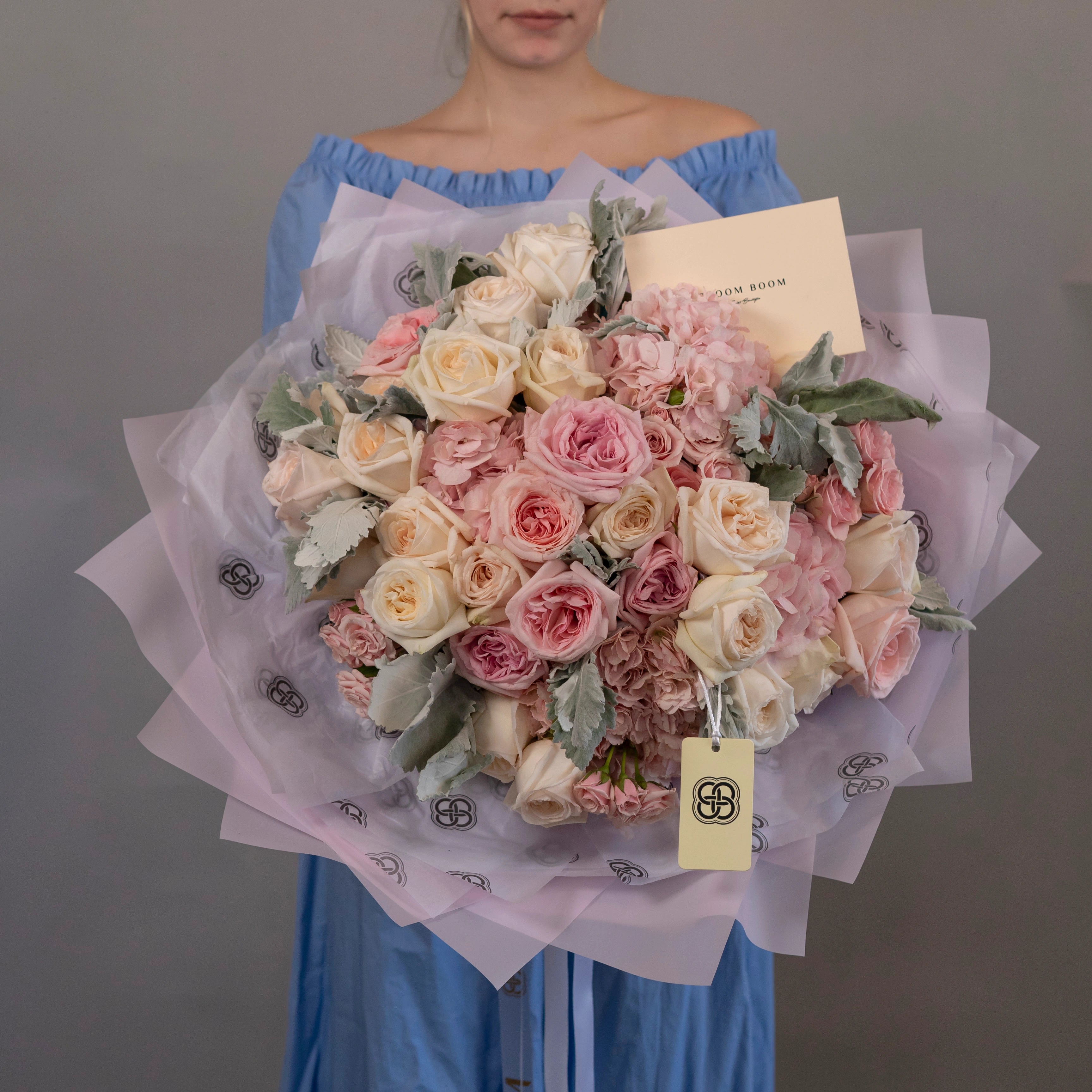 Pink cream rose carnation bouquet with lavender wrapping from Bloom Boom Flowers Los Angeles florist