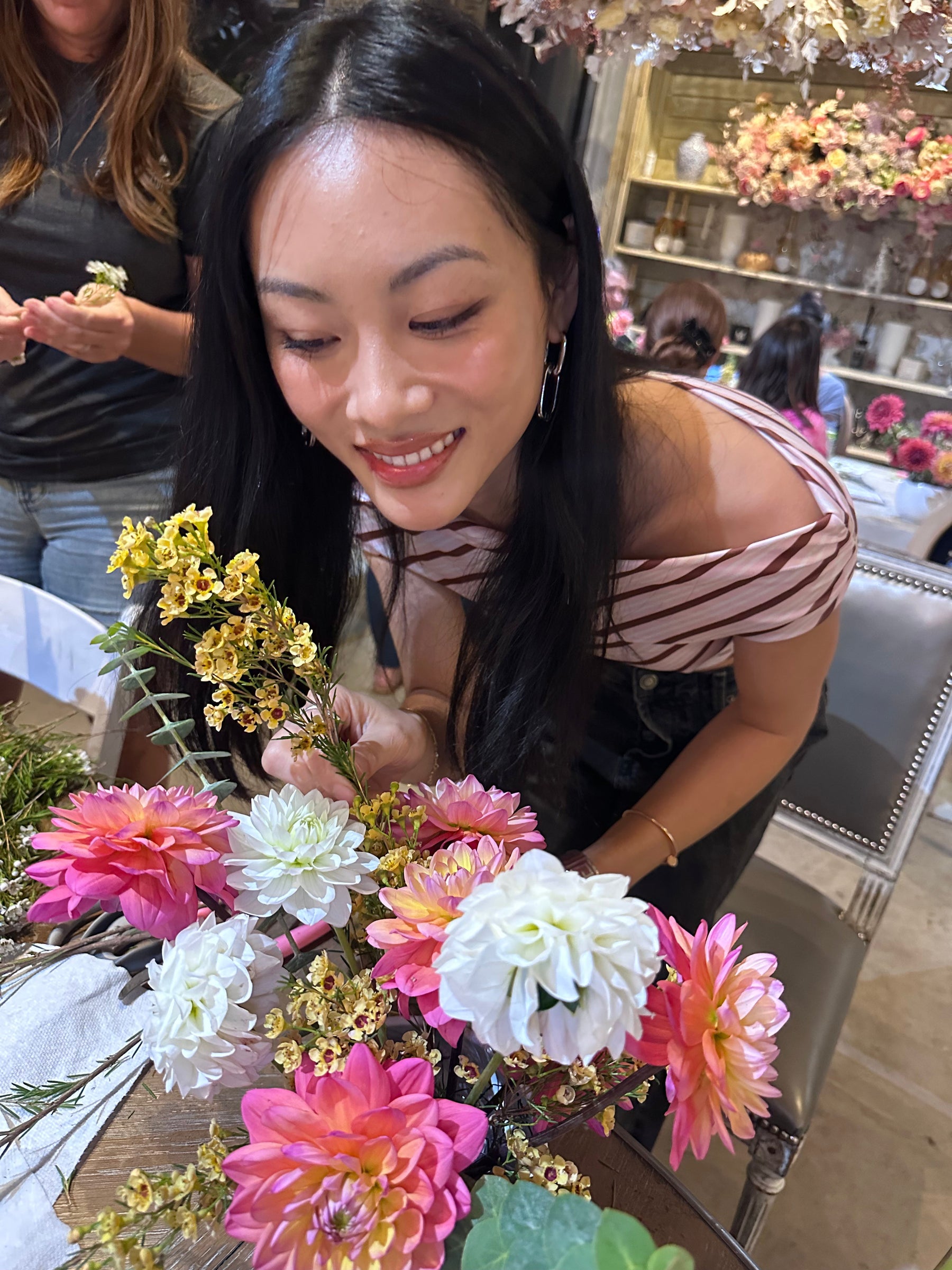 Guests creating floral arrangements at Bloom Boom