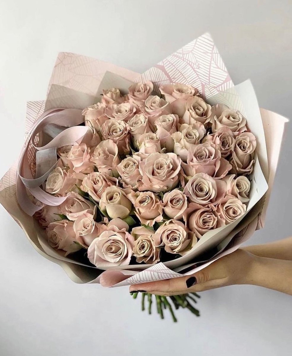 Large bouquet of 39 dusty pink roses wrapped in cream paper with matching satin ribbon bow