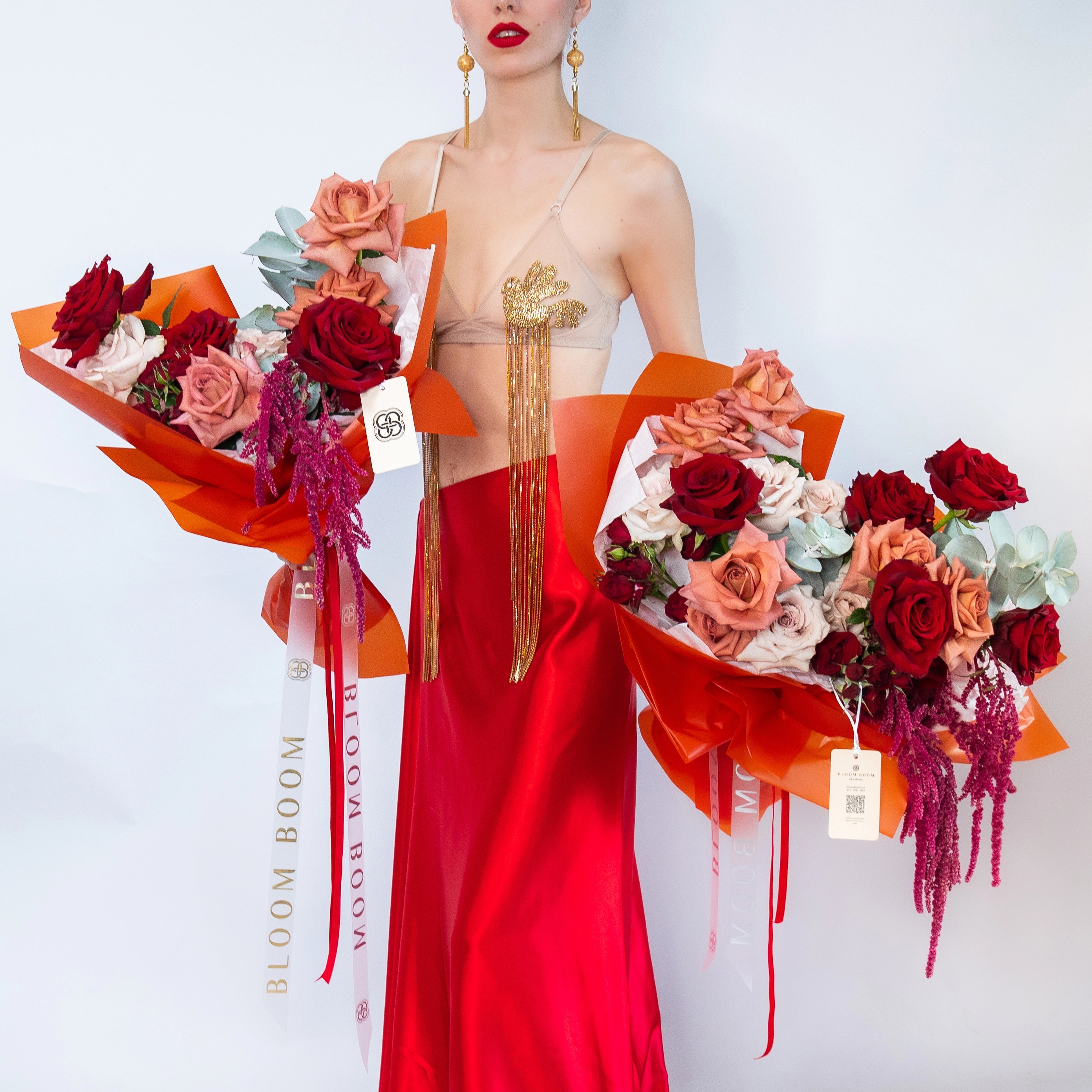 Luxury mixed rose bouquets with red coral pink roses white flowers purple amaranthus orange wrapping Los Angeles